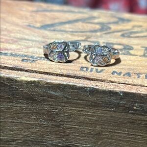 Mini sterling silver butterfly huggie gemstone earrings.